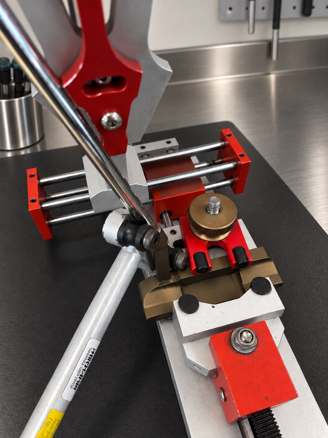 A putter shaft clamped in a loft and lie inspection machine on the workshop bench